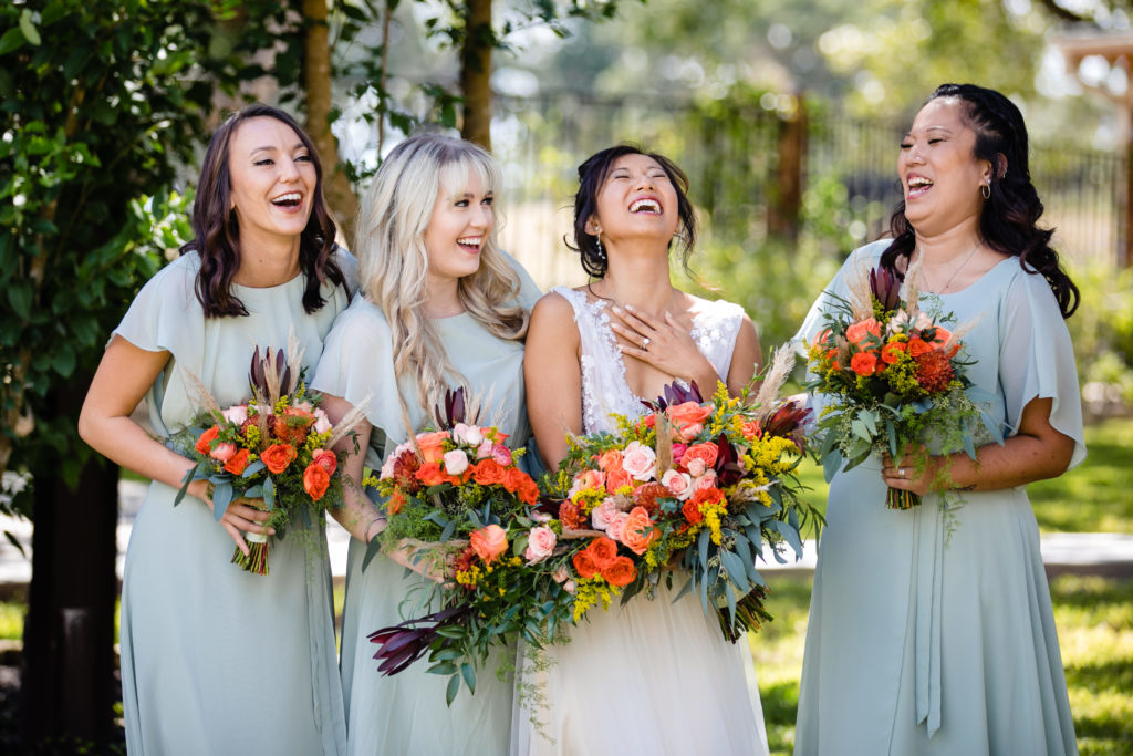 Bride and bridesmaids laugh together at Bergheim Ranch in Boerne.  Photo by Shannon Cain Photography