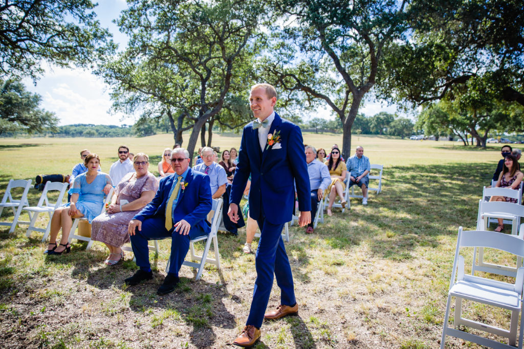 Groom walks down the aisle at Bergheim Ranch in Boerne.  Photo by Shannon Cain Photography
