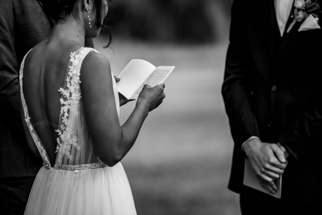 Bride reads her vows during ceremony at Bergheim Ranch in Boerne.  Photo by Shannon Cain Photography