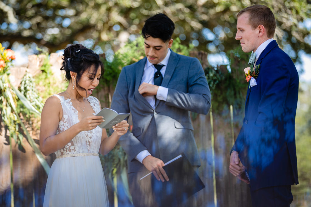 Bride reads her vows during ceremony at Bergheim Ranch in Boerne.  Photo by Shannon Cain Photography