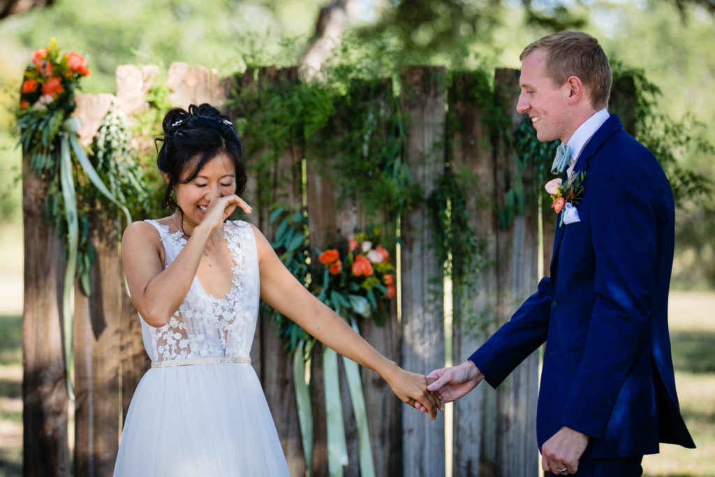 Bride giggles at just being married at Bergheim Ranch in Boerne.  Photo by Shannon Cain Photography