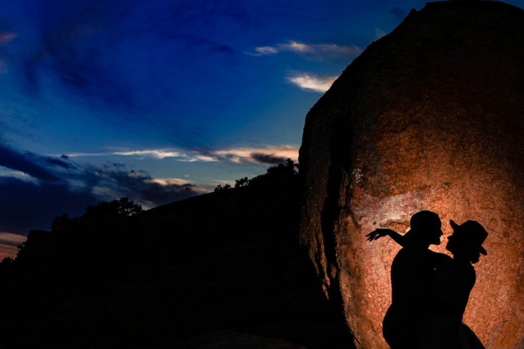Bride and groom silhouette at Enchanted Rock State Park.  Photography by Shannon Cain Photography