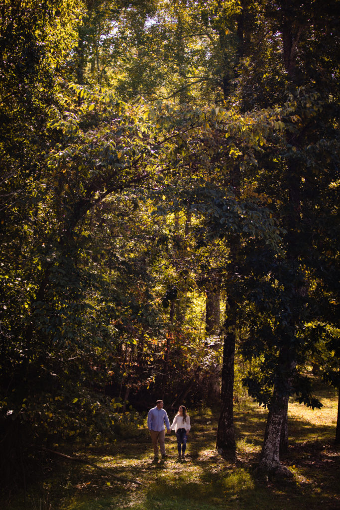 Adventure Engagement Session at Cloudland Canyon State Park in Georgia.  Couple standing under fall foliage.  Photography by Shannon Cain Photography
