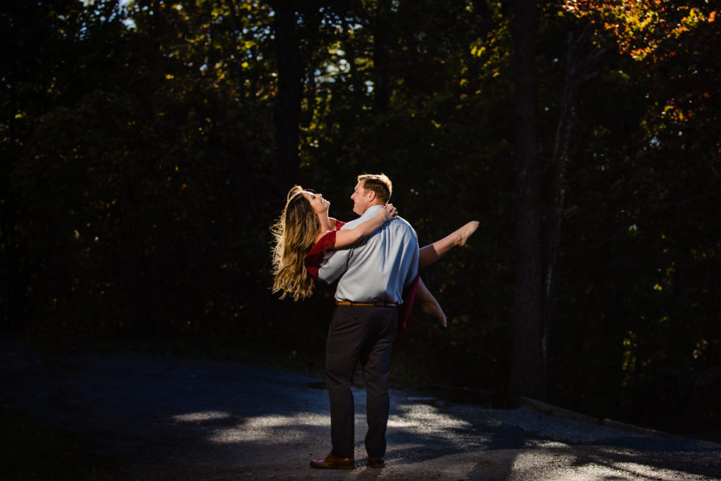 Adventure Engagement Session at Cloudland Canyon State Park in Georgia.  Couple standing under fall foliage.  Photography by Shannon Cain Photography
