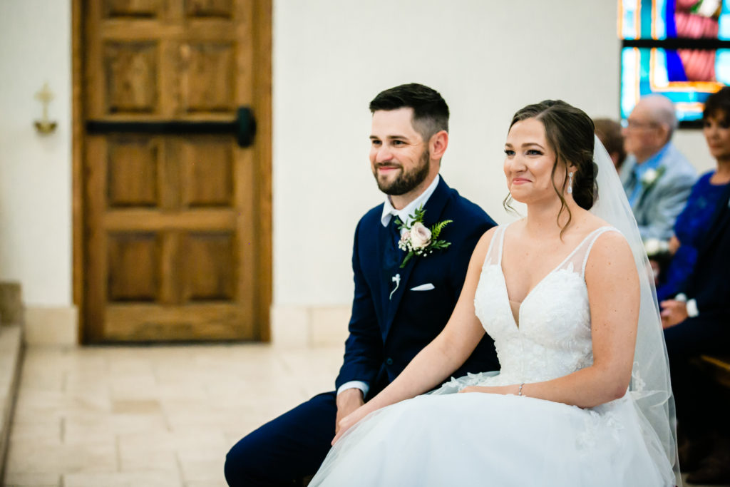 Bride and Groom get married at Holy Trinity Catholic Church and Panna Maria Hall in Panna Maria, TX.  Photography by Shannon Cain Photography