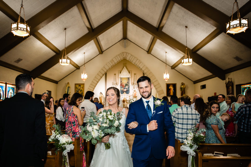 Bride and Groom get married at Holy Trinity Catholic Church and Panna Maria Hall in Panna Maria, TX.  Photography by Shannon Cain Photography